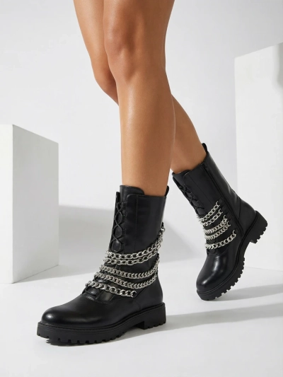 Royalfashion Дамски ботуши тип "багер" в черно Goserre