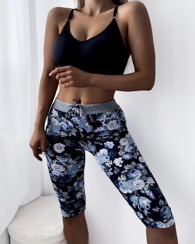 Niebieskie damskie spodenki 3/4 z kwiatowym wzorem PLUS SIZE - Odzież