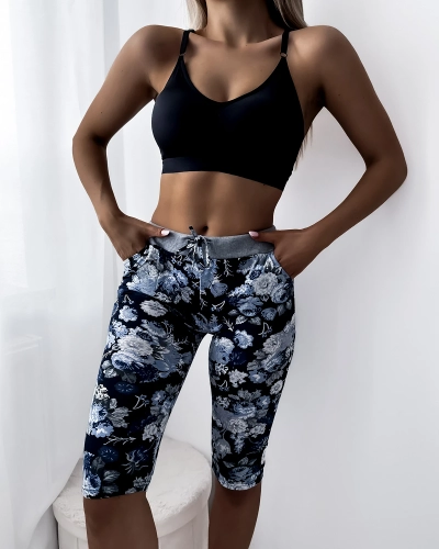 Niebieskie damskie spodenki 3/4 z kwiatowym wzorem PLUS SIZE - Odzież