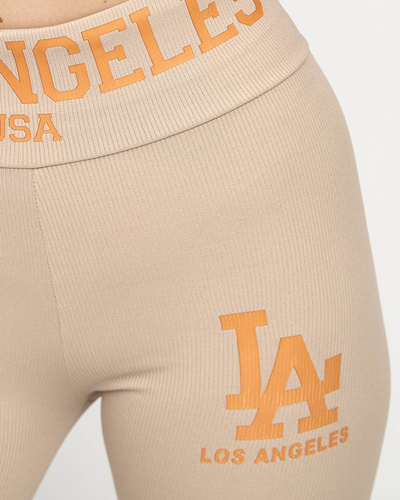 Дамски светлокафяв рипсен клин с оранжеви надписи - Облекло