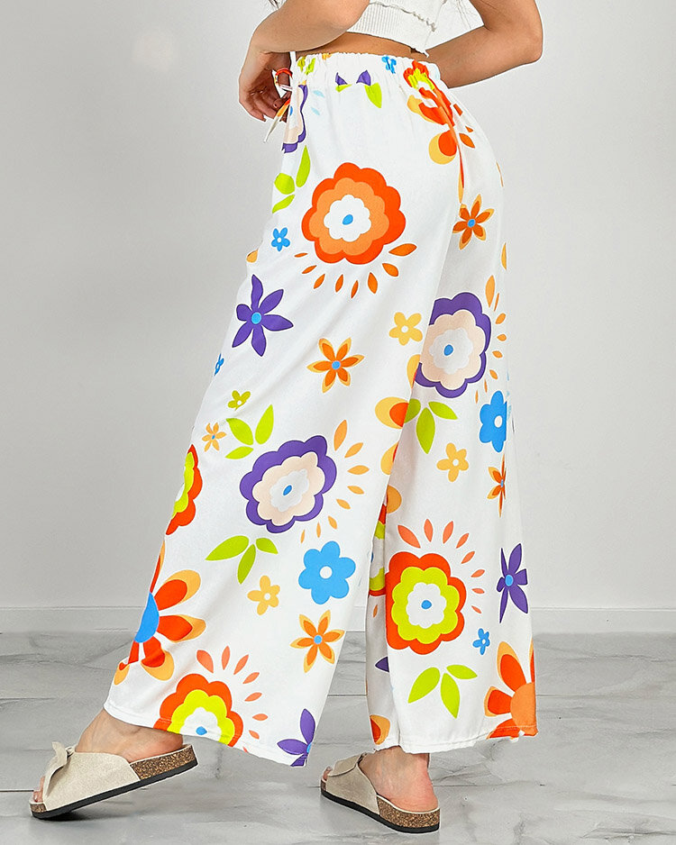 Royalfashion Дамски широки панталони от плат с флорални мотиви