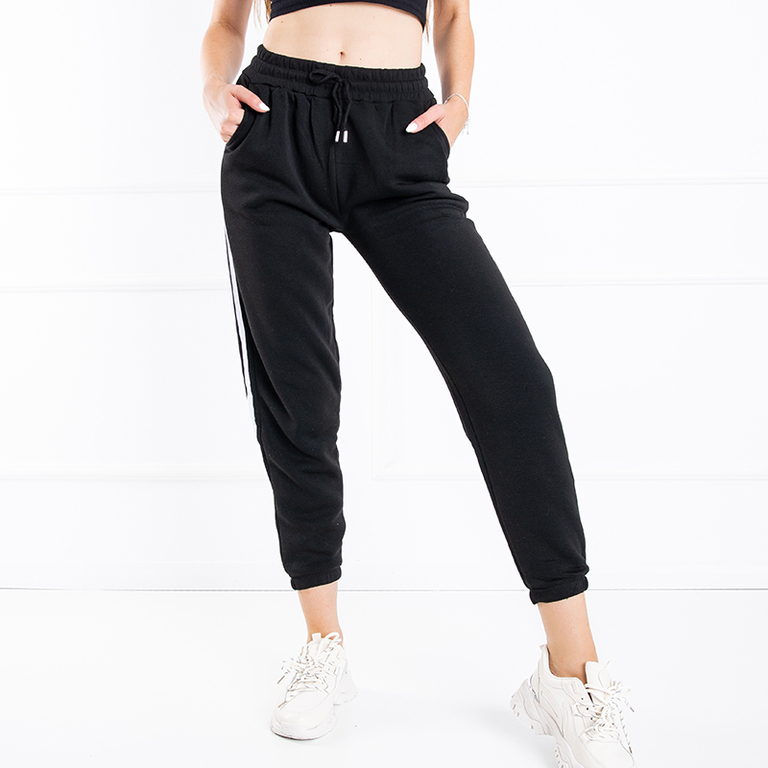 Czarne damskie spodnie dresowe z lampasami - Odzież