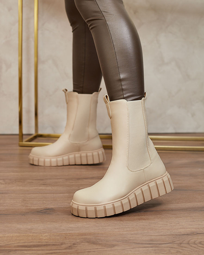 Royalfashion Дамски ботуши с висок плосък ток в екрю Elicane