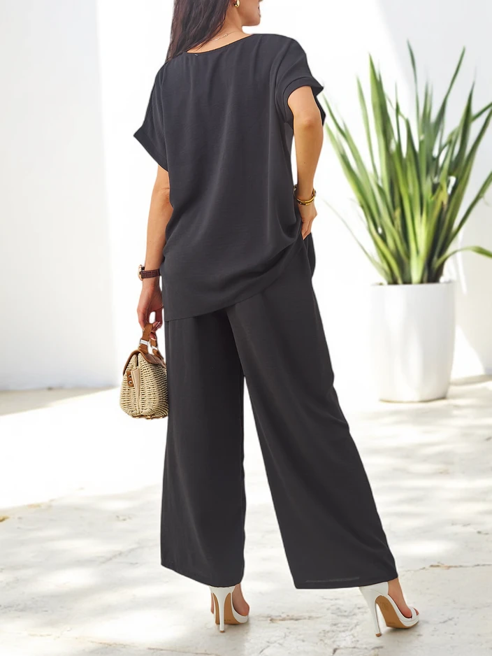 Комплект Royalfashion за жени с къси ръкави, декоративно цвете и широки панталони