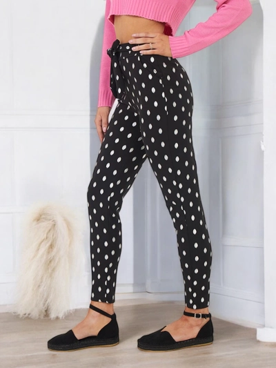 Czarne damskie tregginsy w srebrne kropeczki - Odzież