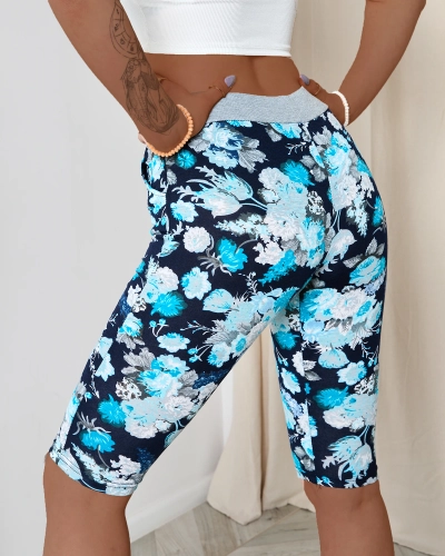 Ciemnoniebieskie damskie spodenki 3/4 z kwiatowym wzorem PLUS SIZE - Odzież