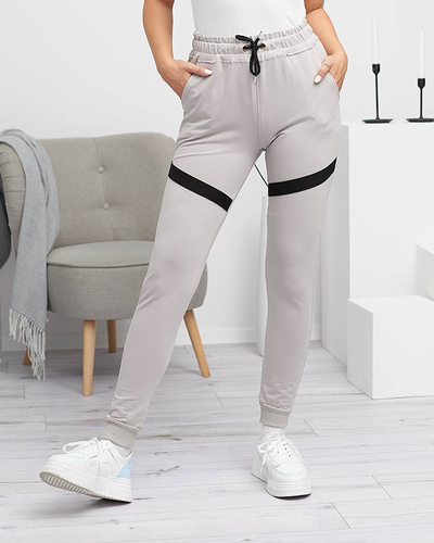 Damskie spodnie dresowe w kolorze jasnoszarym- Odzież