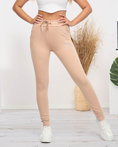 Beżowe damskie spodnie dresowe z cyrkoniami - Odzież