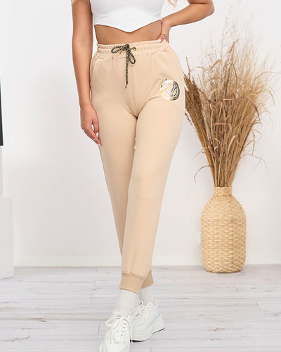 Damskie spodnie dresowe w kolorze beżowym - Odzież