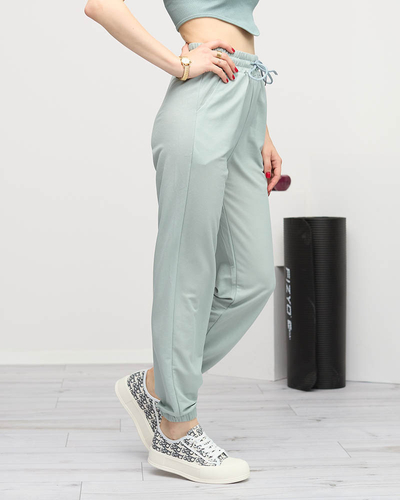 Miętowe dresy damskie z naszywką- Odzież